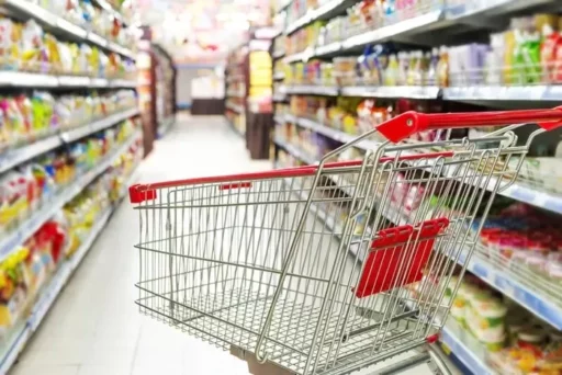 Employee organizing shopping carts at a large supermarket during a heatwave collapses and dies after losing consciousness.